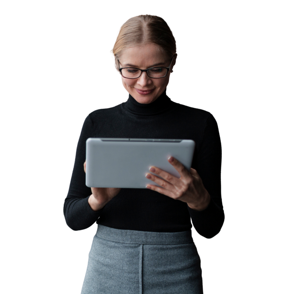 Woman in a black turtleneck glances down at a tablet she holds with both hands against a black background